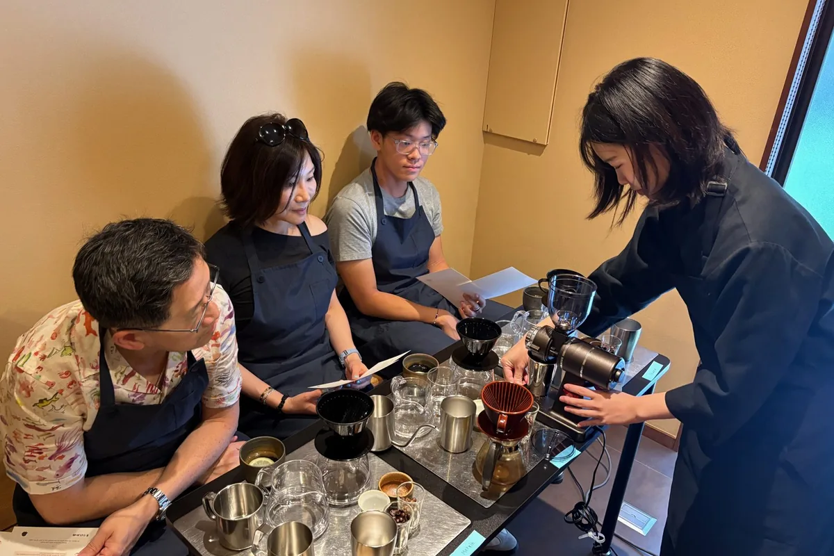Guests learning to brew coffee