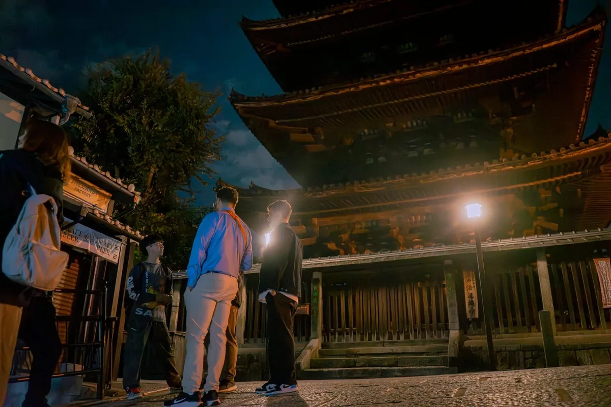 The group beneath Yasaka Pagoda at night