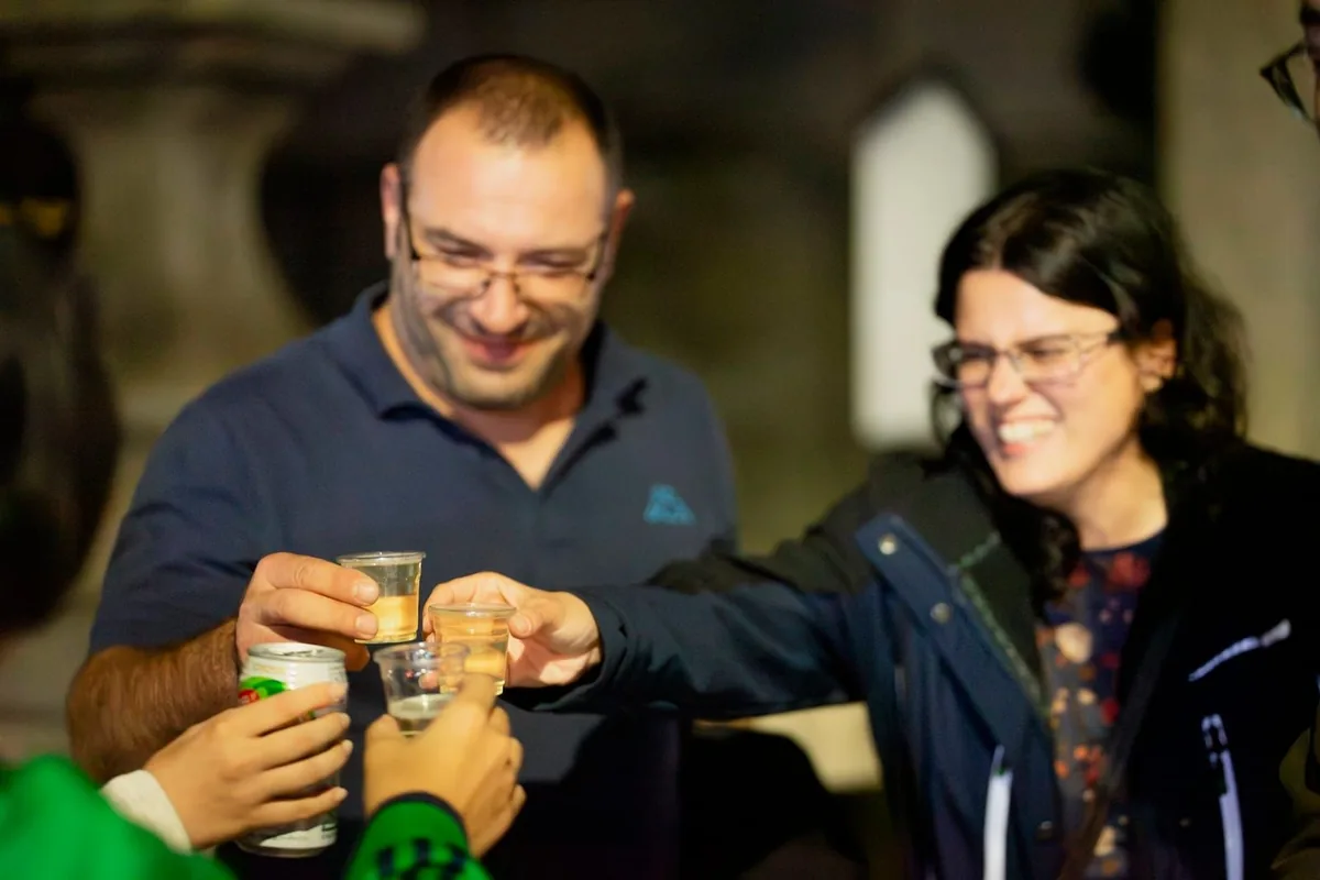 Guests laughing over a toast